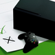 An Xbox Series X over a checklist with a green background.